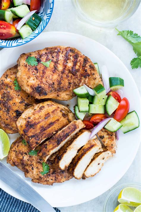 Drizzle the olive oil and rub the seasoning over the chicken breasts, coating them entirely. EASY GRILLED CHICKEN WITH BUTTERMILK MARINADE