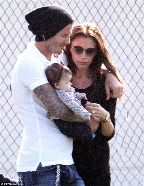 David And Victoria Beckham Share A Tender Cuddle With Baby Harper Seven
