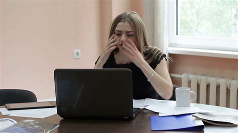 a female employee is tired at work she yawns and sleep close up stock video footage storyblocks