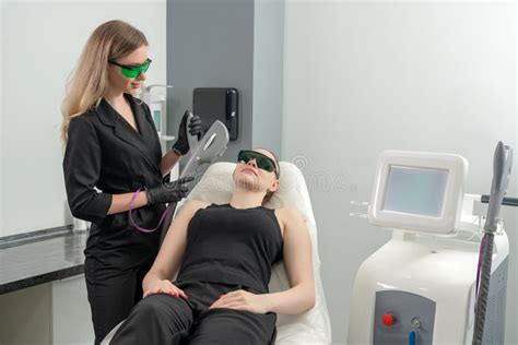 Young Woman Receiving Laser Treatment In Cosmetology Clinic Stock Image Image Of Medical