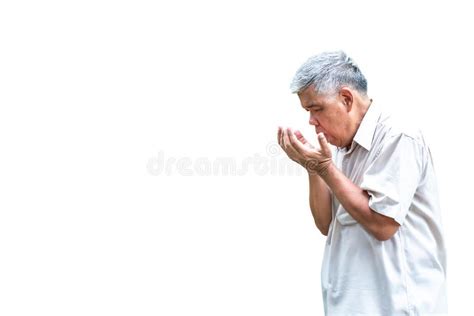 Asian Elderly Man Is Coughing Sore Throat And Looking His Hand Stock