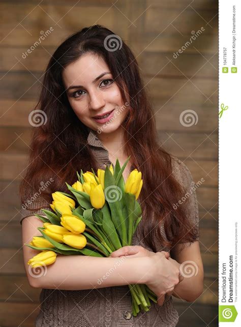 girl with a bouquet of yellow tulips girl with a t of flower stock image image of natural