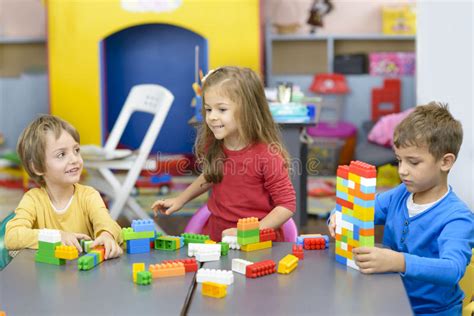 Three Kids Playing At Kindergarten Stock Image Image Of Creative