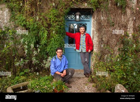 Patrick Gale Red Jacket With His Partner Aidan Hicks In Their Garden At Trevilley Near Land S