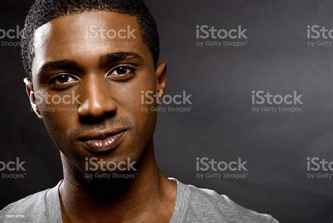 Young African American Man Looking At The Camera Stock Photo Download