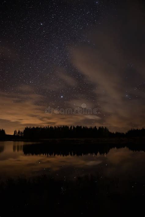 Night Sky With Starts In A Conemara Lake With Pine Forest Around Stock