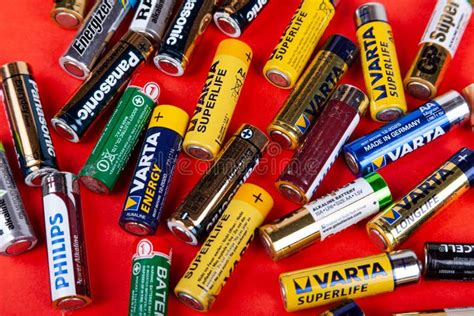 Presentation Of Different Popular Brands Of Aa Batteries Scattered All