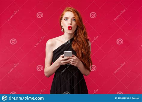 Portrait Of Concerned And Confused Young Redhead Woman Being Dumped By