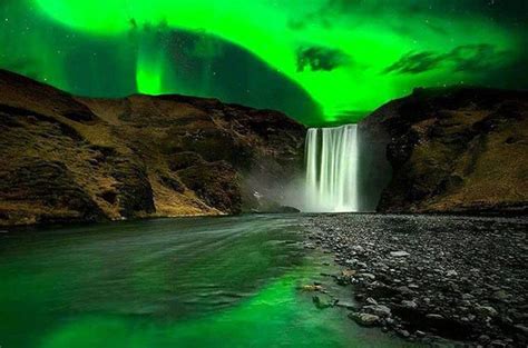 Skógafoss Waterfall At Night Under Northern Lights Iceland