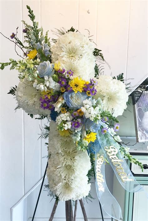 Sympathy Funeral Cross In Blue Yellow And Purple By Petals Florist In