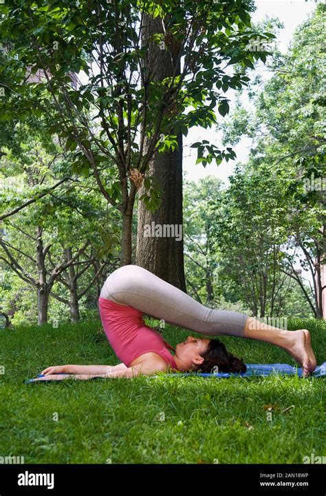 A Woman Stretching In The Plough Plow Pose Stock Photo Alamy