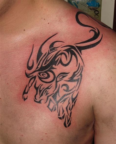 Tribal Big Bull Taurus Tattoo On Chest For Men