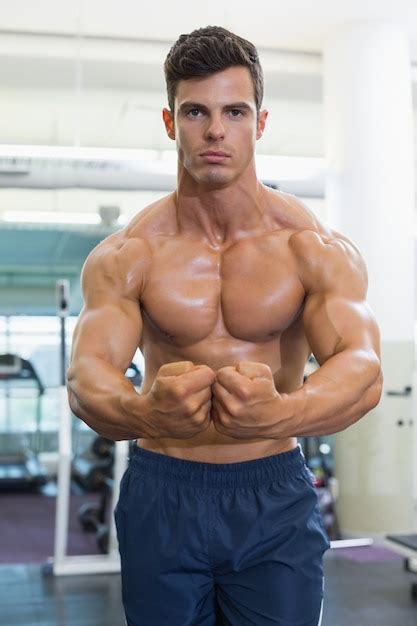 Shirtless Muscular Man Flexing Muscles In Gym Photo Premium Download
