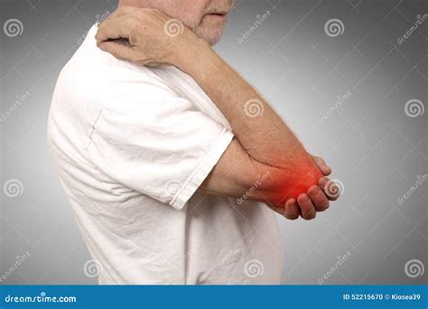 Senior Man With Elbow Inflammation Colored In Red Suffering From Pain