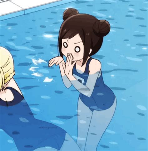 Two People In A Swimming Pool With One Pointing At The Others Face As If To Say Something