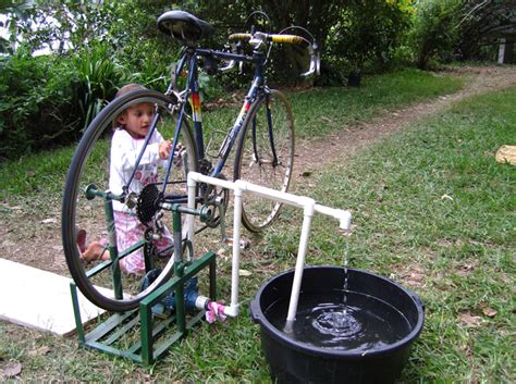 Drip irrigation is the slow and precise delivery of water to chosen plantings. rain barrel watering - bike pump | Irrigation and Watering ...