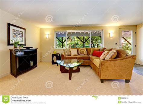 Living Room With Large Sofa Window And Carpet Royalty