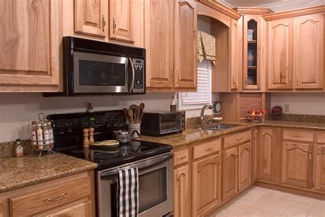 In lighter stains, all of the natural characteristics shine through. Hickory Kitchens - Wood Hollow Cabinets