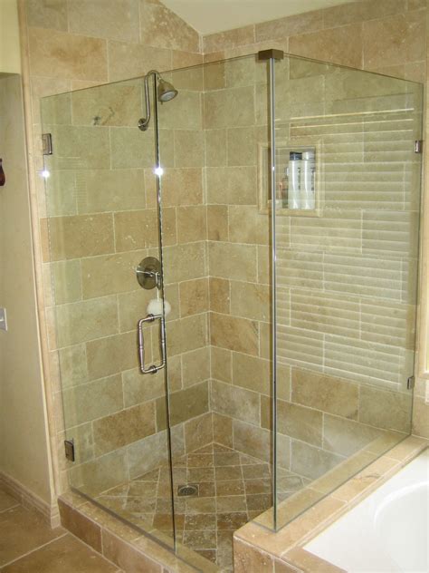 Frameless shower enclosure with glass header at door and clamps at fixed panels in bathroom. Awesome Frameless Shower Doors Options Ideas