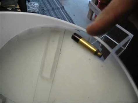 Notice when the brass being dropped from. homemade case feeder - how it works - YouTube