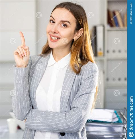 Woman Office Worker Standing And Pointing Finger At Camera Stock Photo