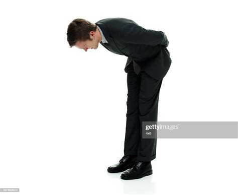 Businessman Bowing High Res Stock Photo Getty Images