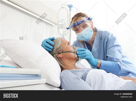 nurse puts oxygen mask image and photo free trial bigstock