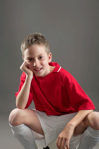 Стоковые видео без лицензионных платежей. Young Boy Sitting On A Ball Stock Photo - Download Image ...