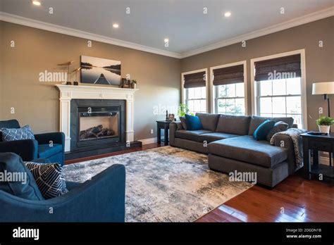 Modern Transitional Living Room With Sectional Sofa And Fireplace Stock