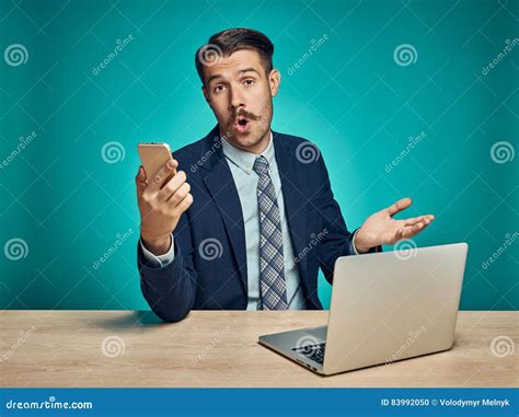 Sad Young Man Working On Laptop At Desk Stock Photo Image Of Pensive