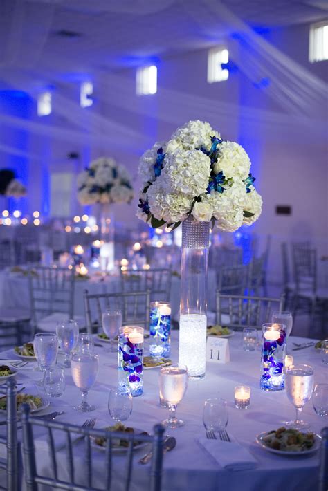White And Silver Reception Decor With Blue Uplighting Silver Wedding