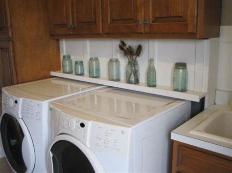 Check out how much space you have and then place there a mini laundry there a white tropical kitchen with sleek minimalist cabinets and a washer and dryer hidden in the kitchen island. how to hide power plugs behind washer/dryer...build a ...