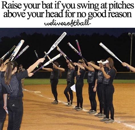 A Group Of Women Holding Baseball Bats On Top Of A Softball Field With