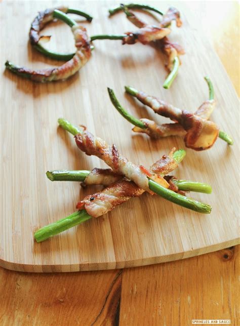 Have you discovered garlic scapes yet? www.garlicrecipes.ca - Bacon Wrapped Garlic Scapes