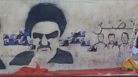 عاجل مصدر يوضح لوطنا اليوم حقيقة رسومات جدارية تمثل الحشد الشعبي و شخصيات ايرانية في شوارع