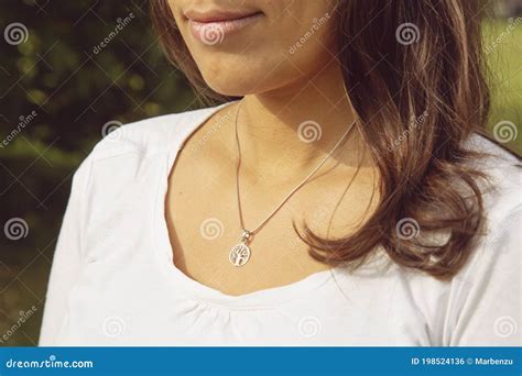 Female Neckline Wearing Tiny Silver Chain With Silver Pendant Stock