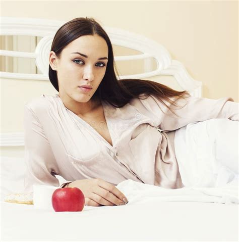 Young Pretty Brunette Woman Laying In Bed Luxury White Interior Stock