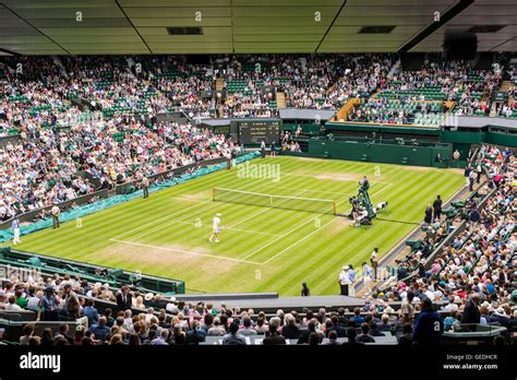 View Of Centre Court Full Of Spectators Watching A Game At Wimbledon
