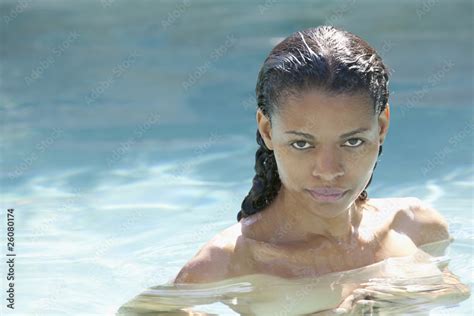 Nude Mixed Race Woman In Swimming Pool Stock Photo Adobe Stock