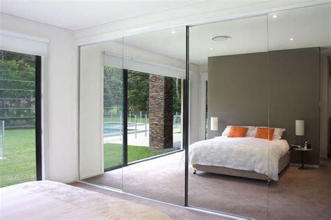 Sliding wardrobes with mirrors use luxury mechanisms for that smooth soft touch feel with a seamless finish and look. Sliding Wardrobe Doors Frameless | The Wardrobe Man