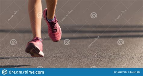 Athlete Runner Feet Running On Road Close Up On Shoe Stock Photo
