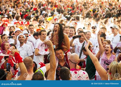 happy topless woman in crowd of people editorial image image 33613235