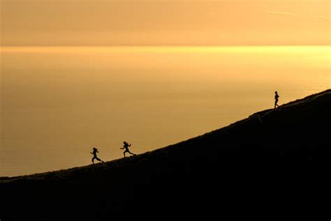 Free Photo Women Silhouettes Running At Sunset With The Ocean In The Background