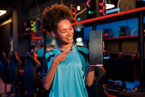 Happy Woman Gamer Stands In Room Of Gaming Club Stock Photo Image Of