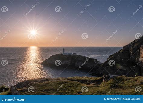 Sunset At South Stack Lighthouse On Anglesey In Wales Stock Image