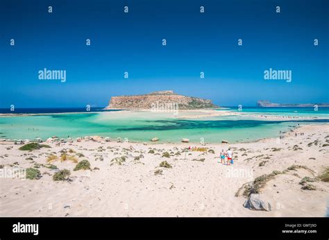 Balos Lagoon On Crete Island Greece Tourists Relax And Bath In