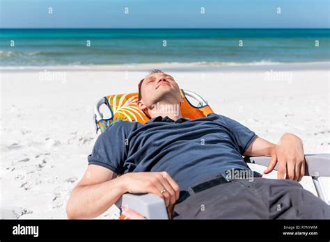 Man Sitting At The Beach In Front Of Ocean Hi Res Stock Photography And