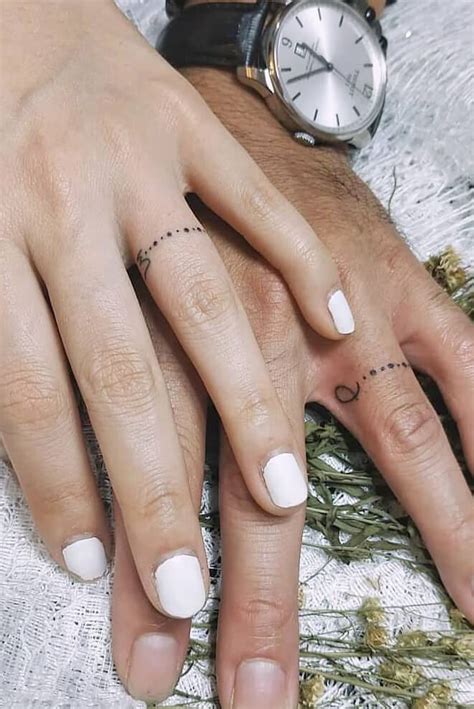 26 Sweet Wedding Ring Tattoo Ideas Ring Tattoo Designs Tattoo Wedding Rings Ring Finger Tattoos