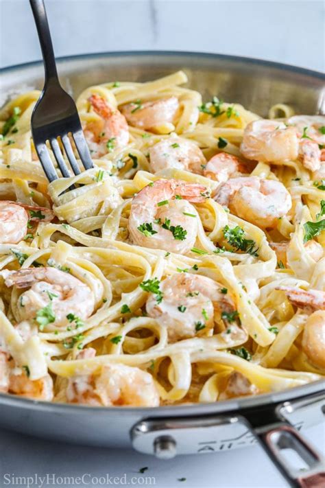 Shrimp Alfredo Pasta In A Pan With A Fork Twirling The Pasta In 2020