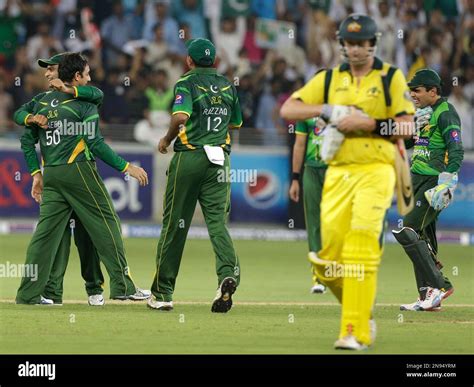 Pakistans Saeed Ajmal Second Left Celebrates With His Teammates
